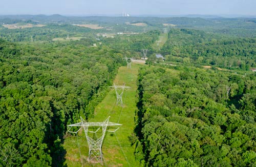 Large power lines crossing over rural Tennessee property, illustrating a utility easement in gross.